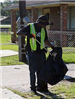 Man placing a piece of trash into a bag