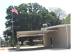Side view of covered parking area and United States flag